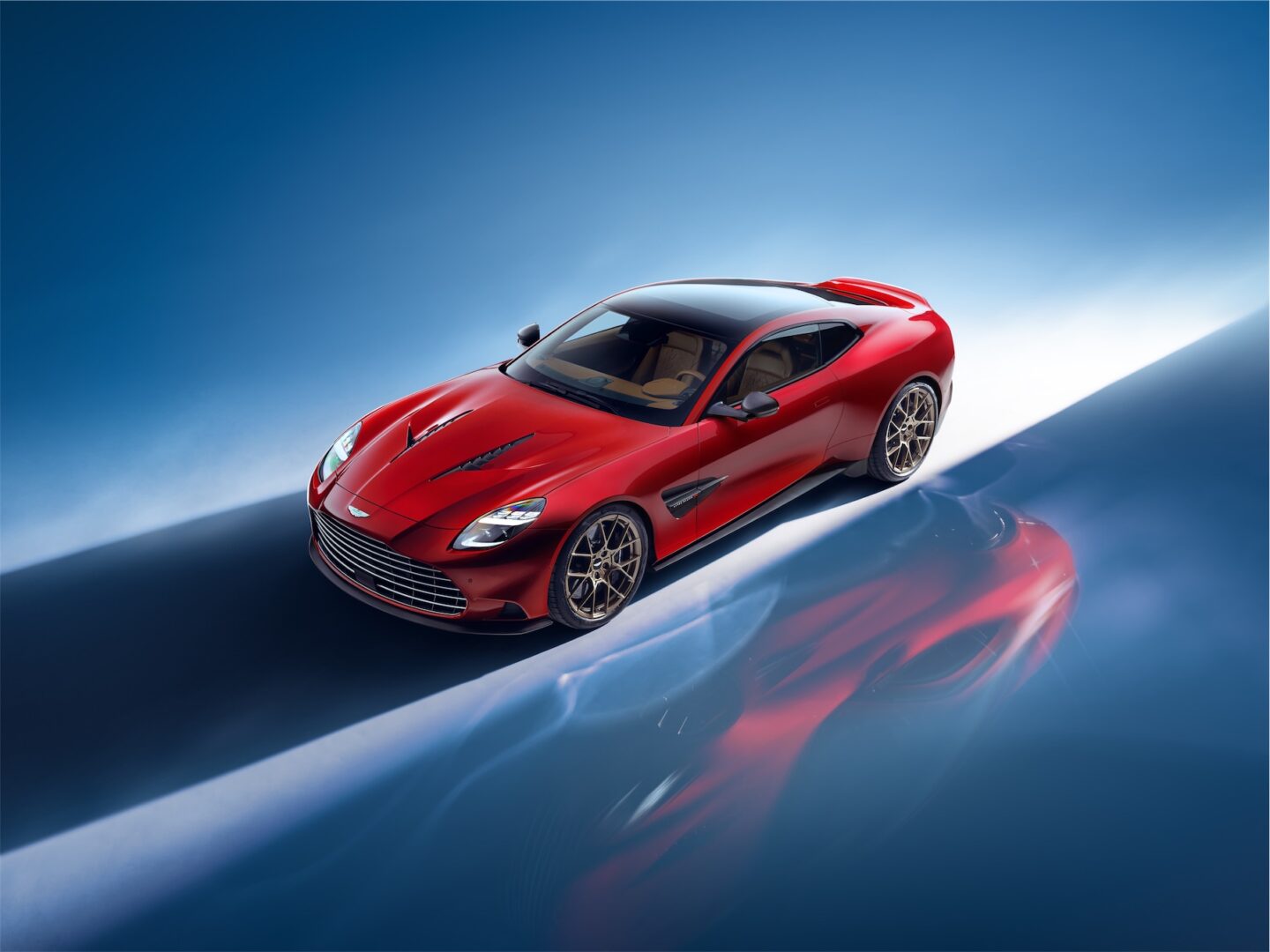 Red 2025 Aston Martin Vanquish, high left view