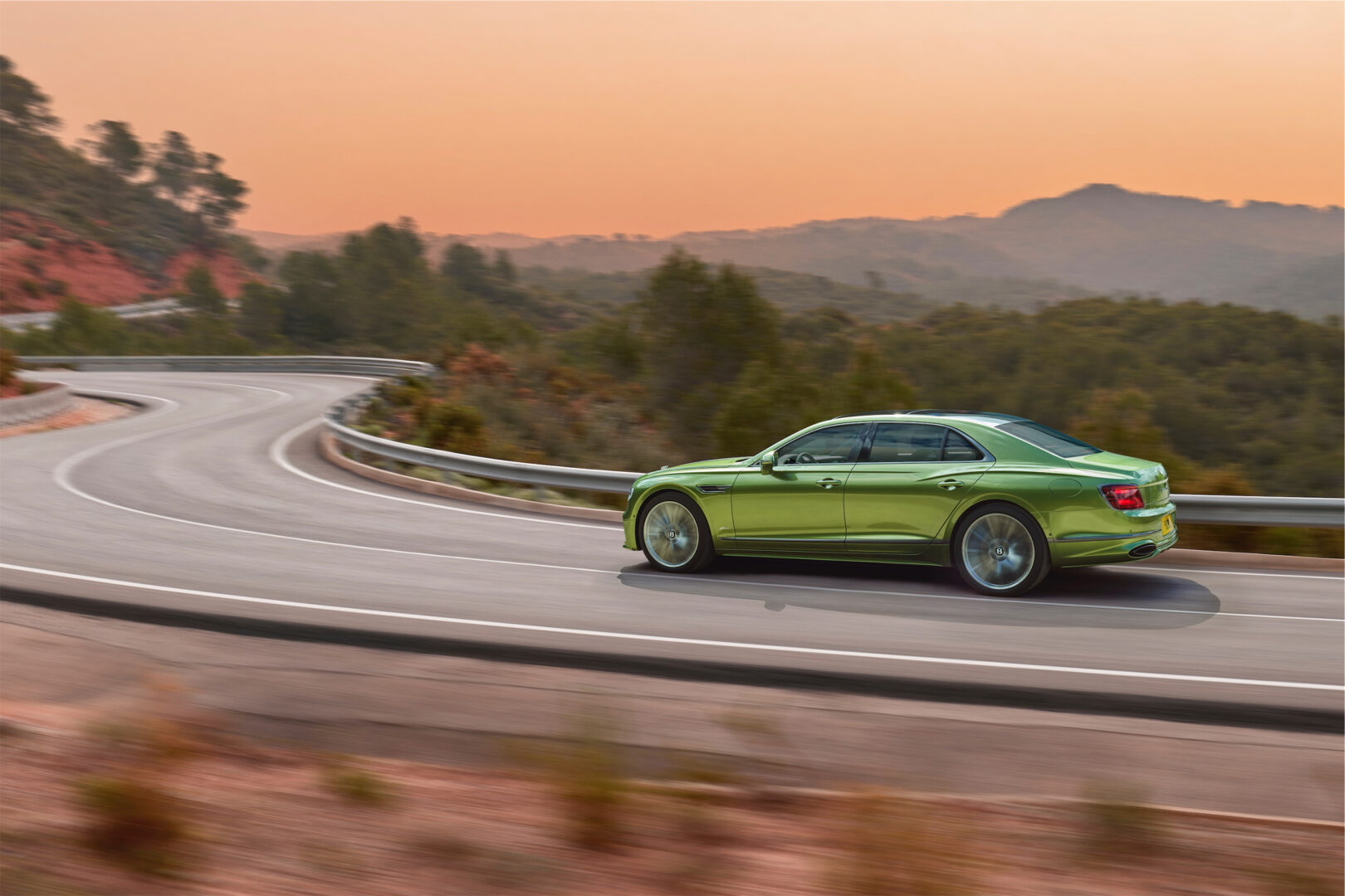 Green 2025 Bentley Flying Spur on road