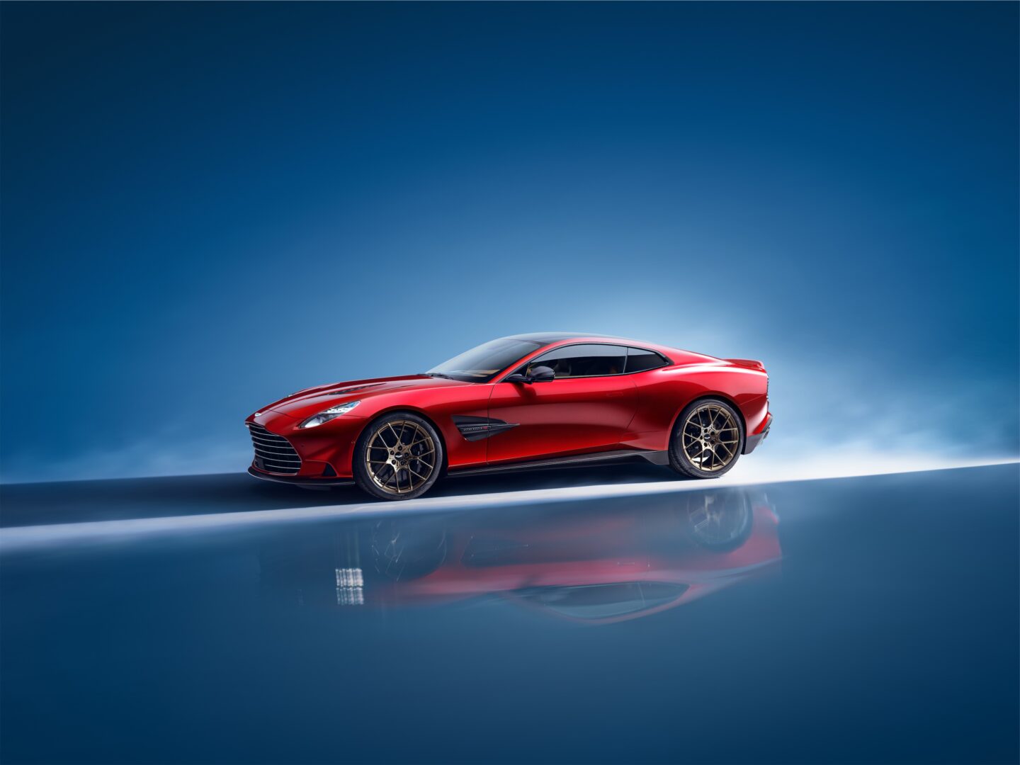 Red 2025 Aston Martin Vanquish left side