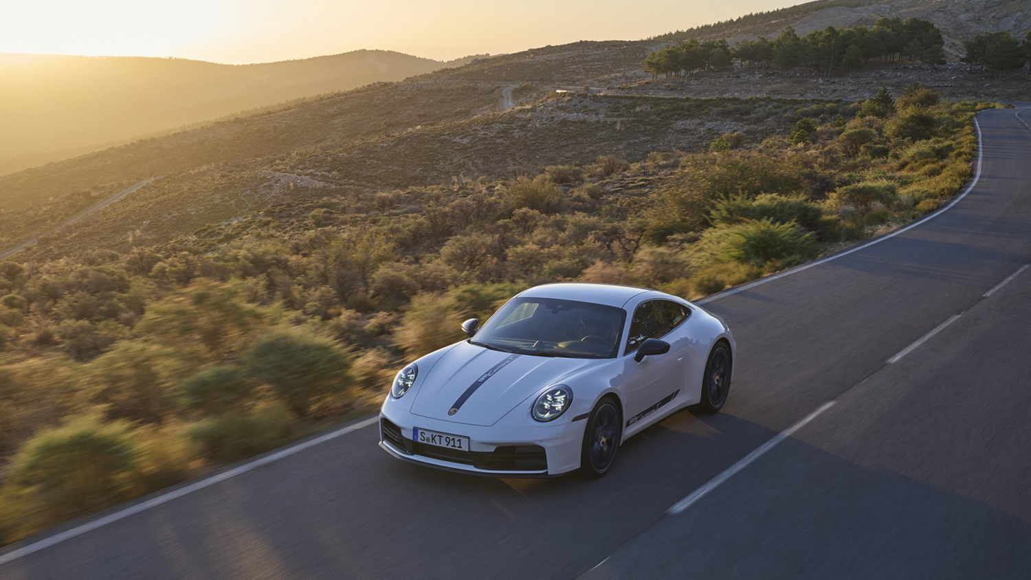 White Porsche 911 Carrera T on road high view