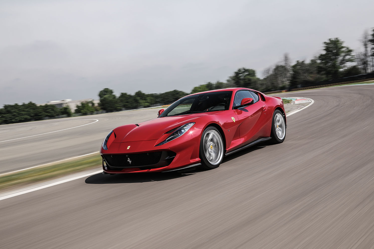 Red Ferrari 812 Superfast on road