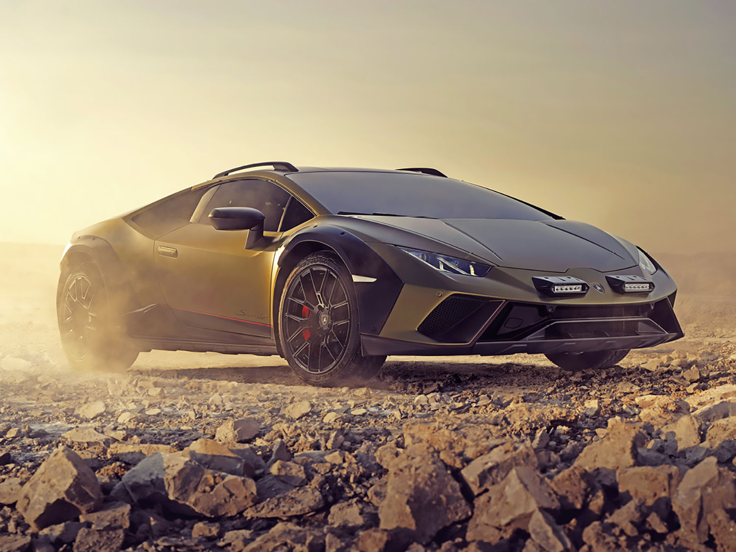 Matte green Lamborghini Huracán Sterrato in desert.