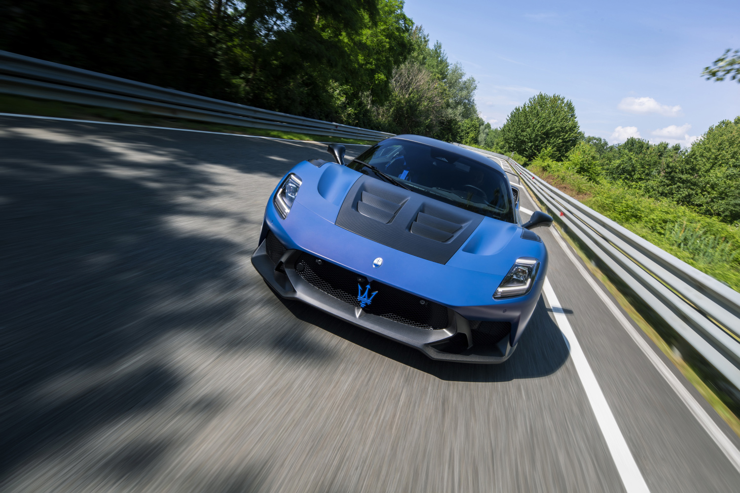 Blue 2025 Maserati MC20 GT2 Stradale on track, front view