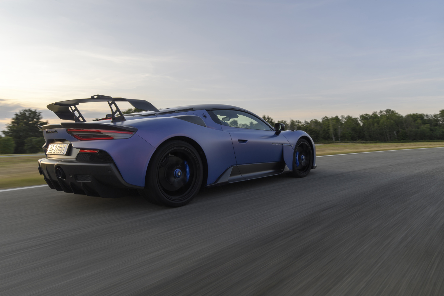 Blue 2025 Maserati MC20 GT2 Stradale on track, rear view