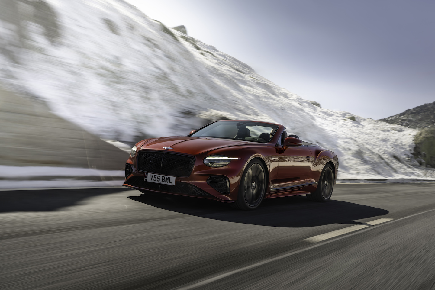 Red 2025 Bentley Continental convertible on road