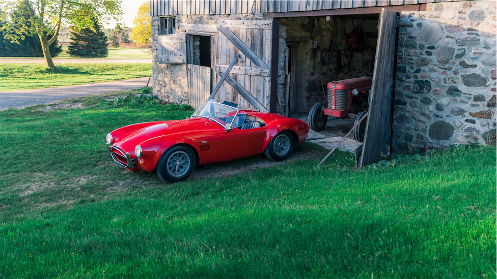 Red Shelby 427 Cobra outside barn